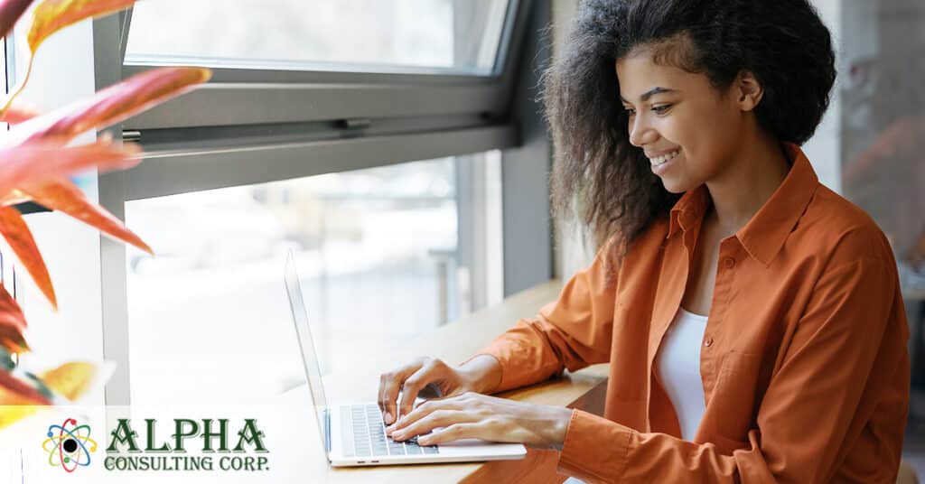 an African American female searching for a job on a laptop