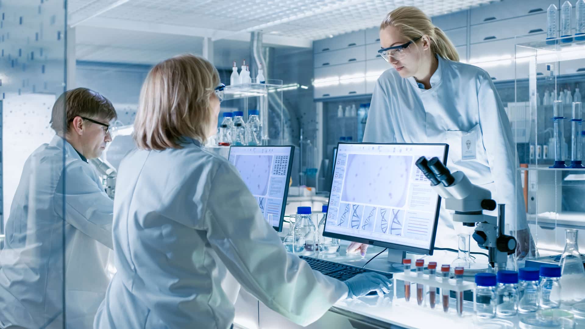 Lab technicians working on computers